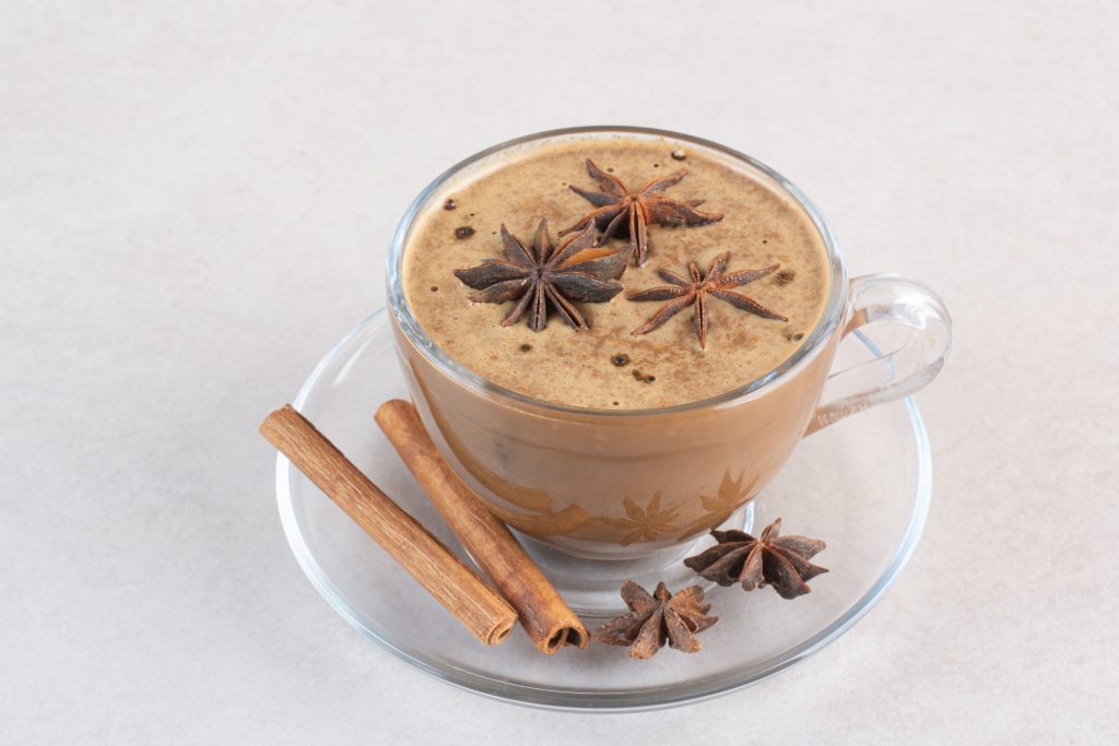 cup-aroma-tasty-coffee-with-cinnamon-sticks-star-anise-high-quality-photo