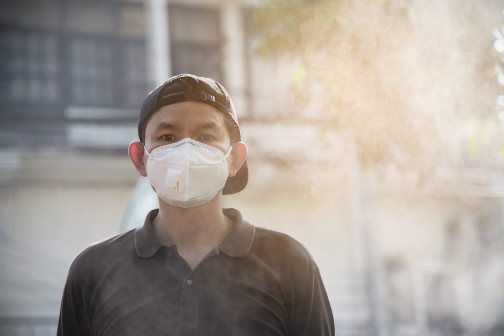 man-wearing-mask-protect-air-pollution-environment