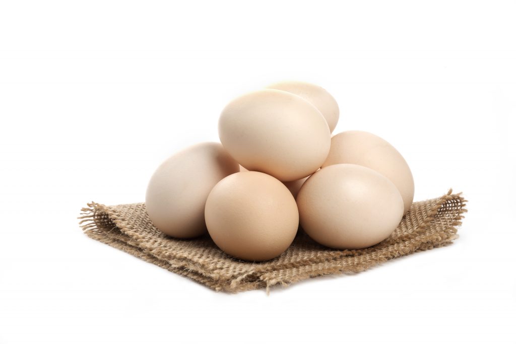 three-fresh-organic-raw-eggs-isolated-white-surface