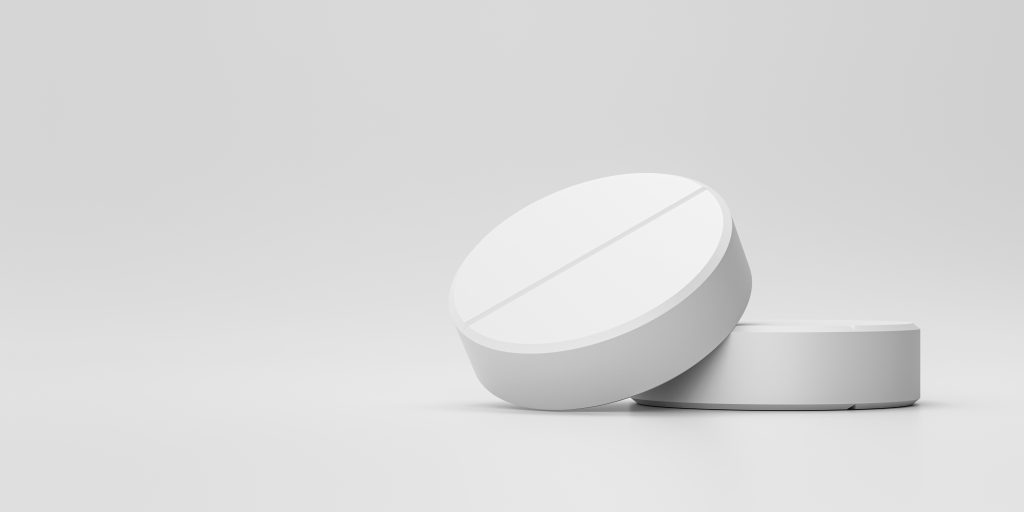 white-tablets-painkillers-with-pharmacy-medical-background-white-pills-alleviating-illness-fever-3d-rendering
