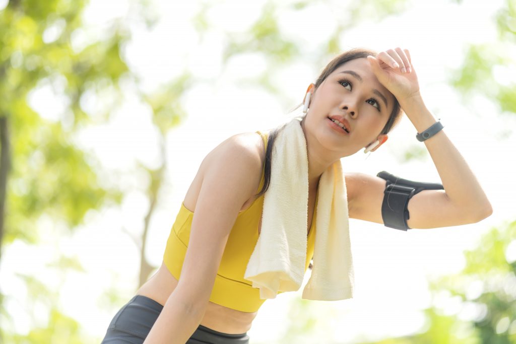 asian-active-female-runner-workout-standing-bent-catching-her-breath-after-running-session-park-garden-sports-female-woman-taking-break-after-run-morning-exercise-lifestyle