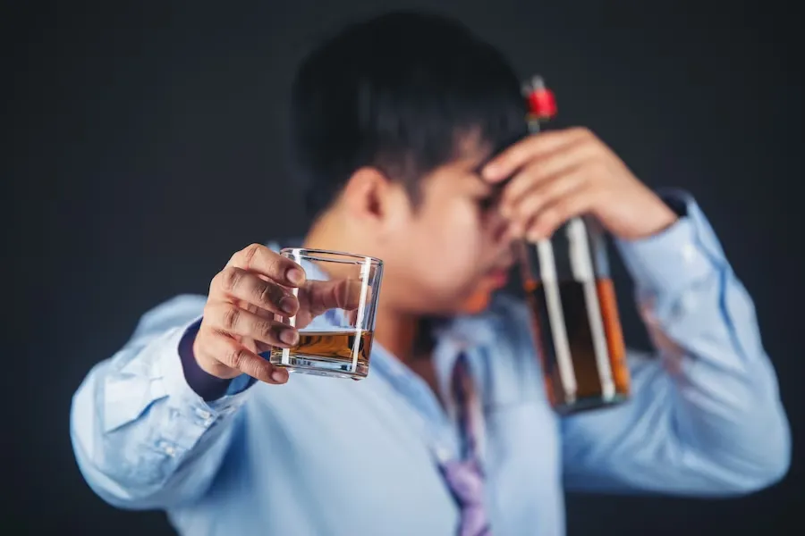 alcoholic-asian-man-drinking-whi