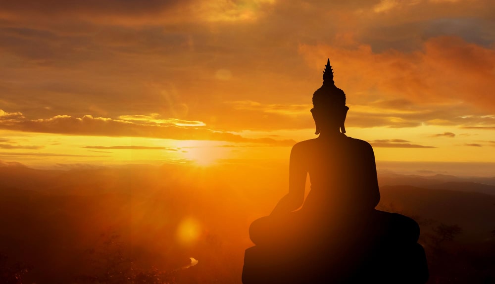buddha-silhouette-golden-sunset-background-beliefs-buddhism-min