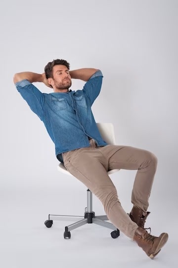 man-posing-with-denim-shirt-sitt-min