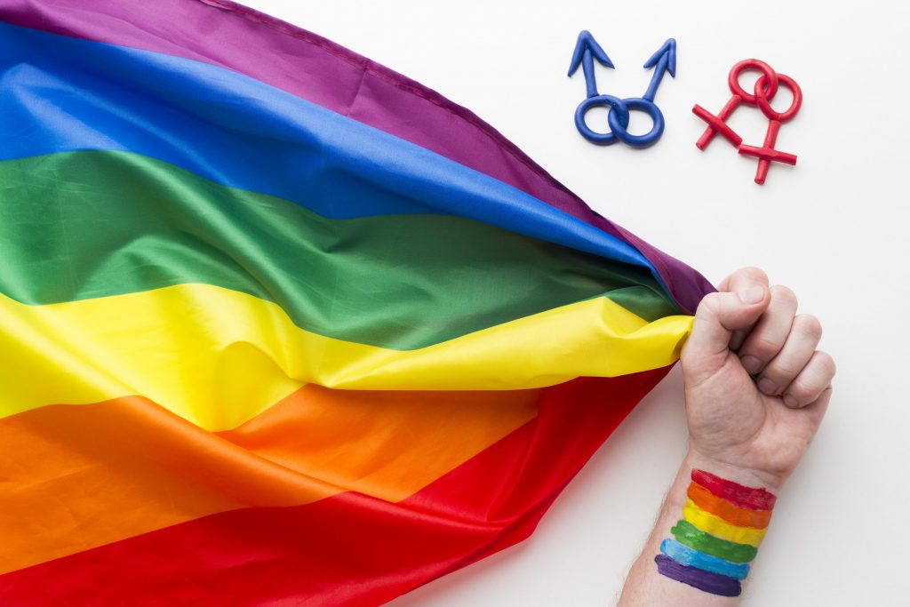 rainbow-pride-flag-with-hand-symbols-min